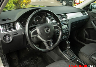 Подержанный автомобиль Skoda Rapid Liftback 2014 года (14 фото)