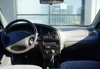 Подержанный автомобиль Kia Spectra Sedan 2009 года (12 фото)