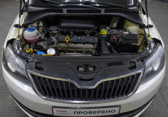 Подержанный автомобиль Skoda Rapid Liftback 2014 года (9 фото)
