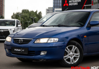 Подержанный автомобиль Mazda 626 Sedan 2001 года (14 фото)