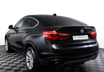 Подержанный автомобиль BMW X6 2015 года (7 фото)