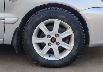 Подержанный автомобиль Mitsubishi Lancer Sedan 2005 года (13 фото)