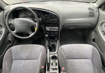 Подержанный автомобиль Kia Spectra Sedan 2006 года (10 фото)