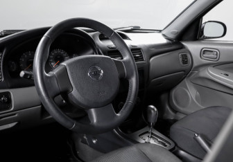 Подержанный автомобиль Nissan Almera Classic 2009 года (13 фото)