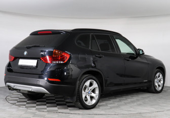 Подержанный автомобиль BMW X1 2014 года (2 фото)