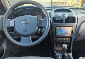 Подержанный автомобиль Nissan Almera Classic 2007 года (13 фото)
