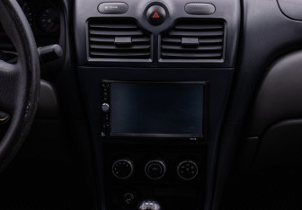 Подержанный автомобиль Nissan Almera Sedan 2012 года (14 фото)