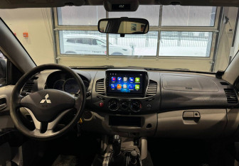 Подержанный автомобиль Mitsubishi L200 2007 года (15 фото)