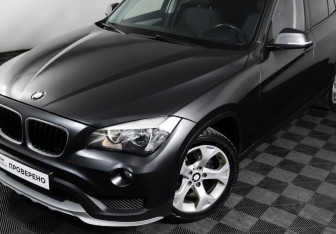 Подержанный автомобиль BMW X1 2014 года (23 фото)