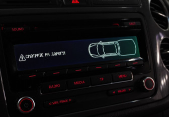 Подержанный автомобиль Volkswagen Tiguan 2012 года (14 фото)