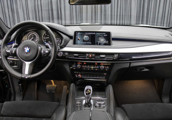 Подержанный автомобиль BMW X6 2017 года (14 фото)