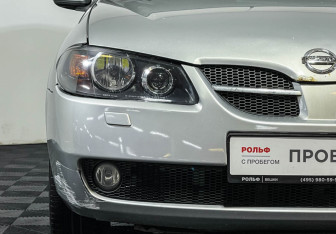 Подержанный автомобиль Nissan Almera Hatchback 2006 года (14 фото)