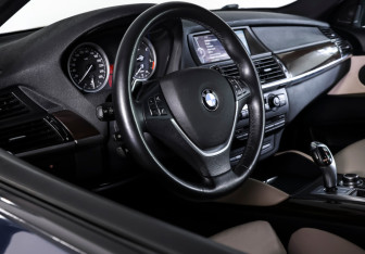 Подержанный автомобиль BMW X6 2013 года (14 фото)