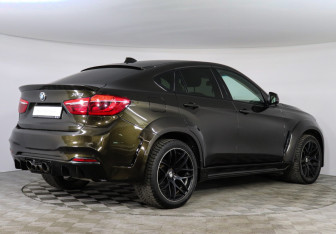 Подержанный автомобиль BMW X6 2015 года (2 фото)