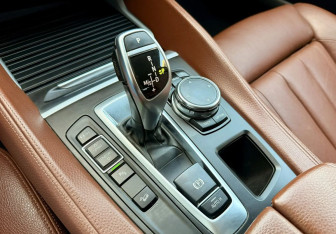 Подержанный автомобиль BMW X6 2015 года (13 фото)