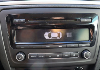 Подержанный автомобиль Skoda Rapid Liftback 2014 года (21 фото)