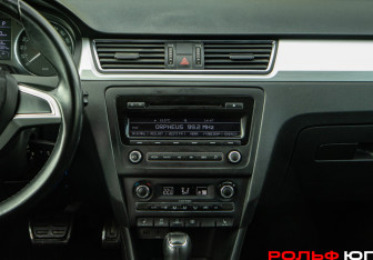 Подержанный автомобиль Skoda Rapid Liftback 2014 года (12 фото)