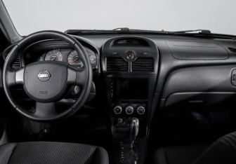 Подержанный автомобиль Nissan Almera Classic 2009 года (11 фото)