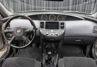 Подержанный автомобиль Nissan Primera Sedan 2003 года (14 фото)