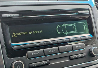 Подержанный автомобиль Volkswagen Tiguan 2012 года (13 фото)