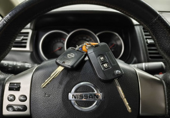 Подержанный автомобиль Nissan Tiida Sedan 2010 года (15 фото)