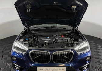 Подержанный автомобиль BMW X1 2015 года (10 фото)