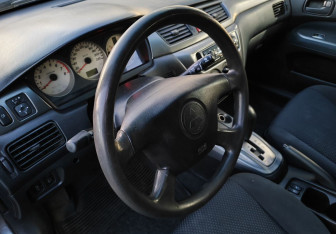 Подержанный автомобиль Mitsubishi Lancer Sedan 2005 года (12 фото)