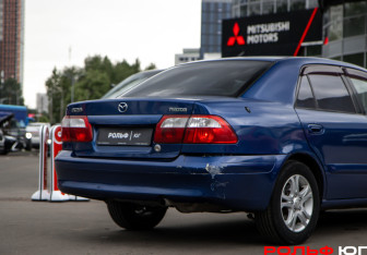 Подержанный автомобиль Mazda 626 Sedan 2001 года (15 фото)