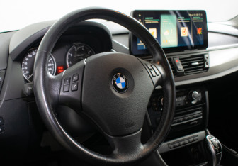 Подержанный автомобиль BMW X1 2014 года (13 фото)