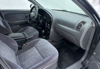 Подержанный автомобиль Kia Spectra Sedan 2007 года (13 фото)