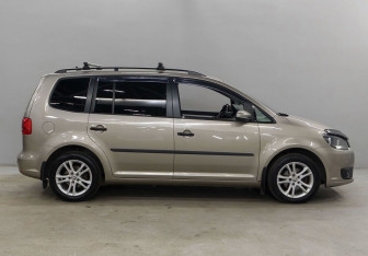 Подержанный автомобиль Volkswagen Touran 2013 года (4 фото)