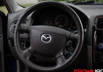Подержанный автомобиль Mazda 626 Sedan 2001 года (11 фото)
