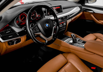 Подержанный автомобиль BMW X6 2016 года (7 фото)