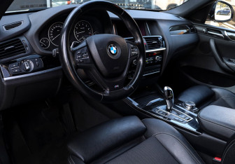 Подержанный автомобиль BMW X4 2015 года (11 фото)