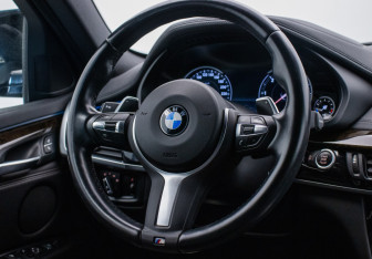 Подержанный автомобиль BMW X6 2018 года (15 фото)