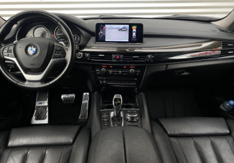 Подержанный автомобиль BMW X6 2016 года (12 фото)