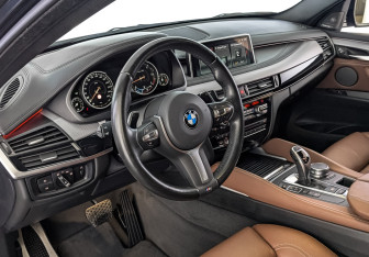Подержанный автомобиль BMW X6 2018 года (15 фото)
