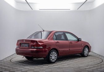 Подержанный автомобиль Mitsubishi Lancer Sedan 2006 года (5 фото)
