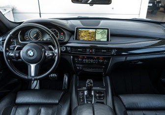 Подержанный автомобиль BMW X6 2016 года (14 фото)