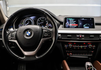 Подержанный автомобиль BMW X6 2016 года (7 фото)