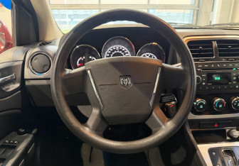 Подержанный автомобиль Dodge Caliber 2010 года (13 фото)