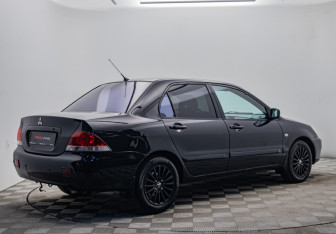 Подержанный автомобиль Mitsubishi Lancer Sedan 2006 года (5 фото)