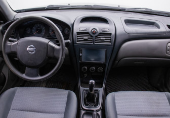 Подержанный автомобиль Nissan Almera Sedan 2012 года (13 фото)