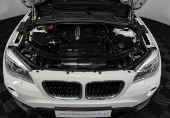 Подержанный автомобиль BMW X1 2013 года (10 фото)
