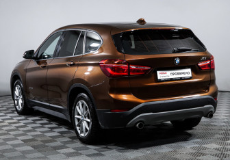 Подержанный автомобиль BMW X1 2015 года (7 фото)