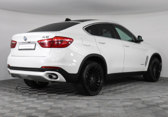Подержанный автомобиль BMW X6 2015 года (2 фото)