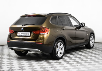 Подержанный автомобиль BMW X1 2011 года (5 фото)