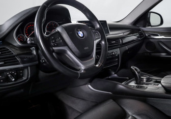 Подержанный автомобиль BMW X6 2016 года (14 фото)