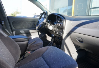 Подержанный автомобиль Kia Spectra Sedan 2009 года (11 фото)