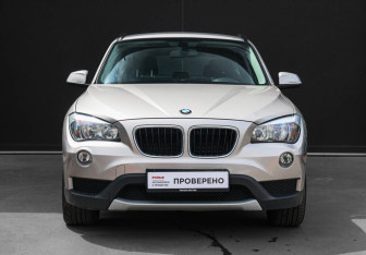 Подержанный автомобиль BMW X1 2014 года (2 фото)